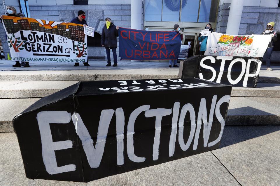 FILE - In this Jan. 13, 2021, file photo, tenants' rights advocates demonstrate in front of the Edward W. Brooke Courthouse in Boston. President Joe Biden’s administration is cutting things close on a nationwide eviction moratorium, which is set to expire in less than a week. (AP Photo/Michael Dwyer, File)