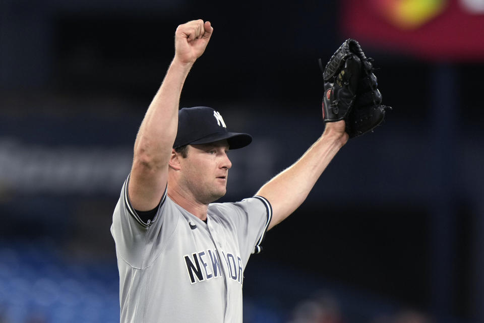 New York Yankees starting pitcher Gerrit Cole raises his arms after he two-hit the Toronto Blue Jays in a baseball game Wednesday, Sept. 27, 2023, in Toronto. (Frank Gunn/The Canadian Press via AP)