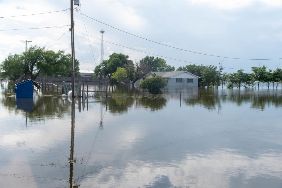 The flooded house of Mary Puckett is seen June 6 on 77th Street near Amarillo across from Greenways.