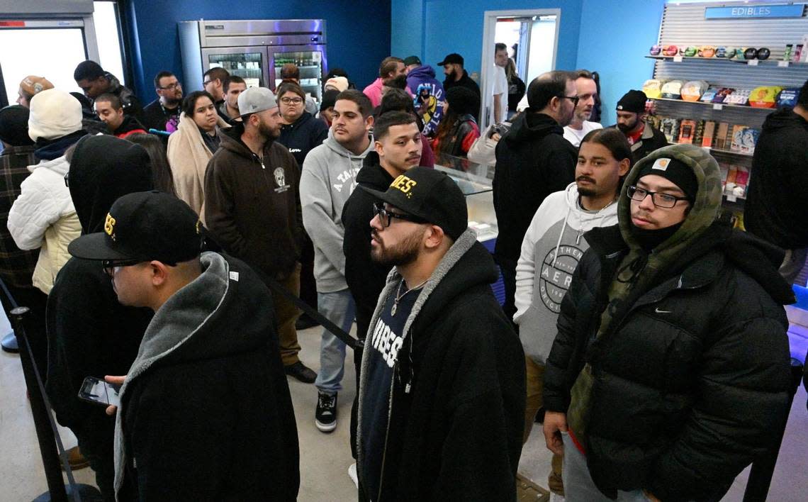 Cusomers are seen in line to purchase at the grand opening of Cookies, Fresno’s newest cannabis dispensary Sunday morning, Dec. 17, 2023. Cookies CEO Berner, born Gilbert Anthony Milam, Jr., was in attendance for the dispensary’s opening which is located at the northeast corner of Blackstone and Shaw avenues.