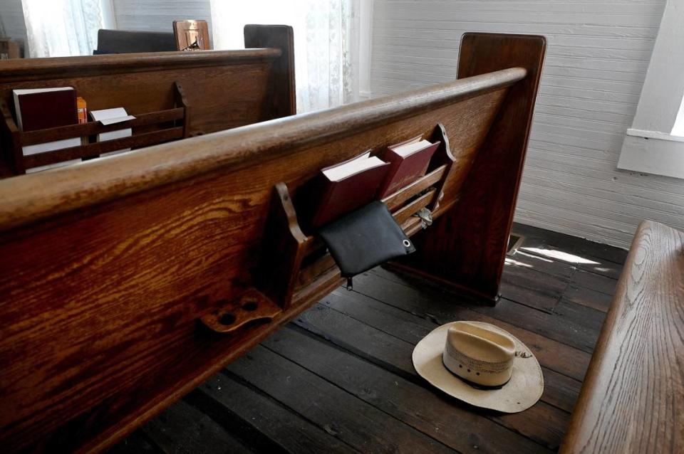 Erected in 1908, the Sandy Baptist Church in Myakka City withstood Hurricane Ian’s brutal winds, suffering some roof and window damage. A cowboy hat lies on the floor between the pews, blown from a peg in the back of the church.