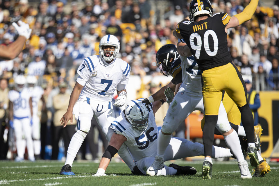 Indianapolis Colts offensive guard Quenton Nelson (56) falls on Colts quarterback Jacoby Brissett's leg on Sunday. (Getty Images)