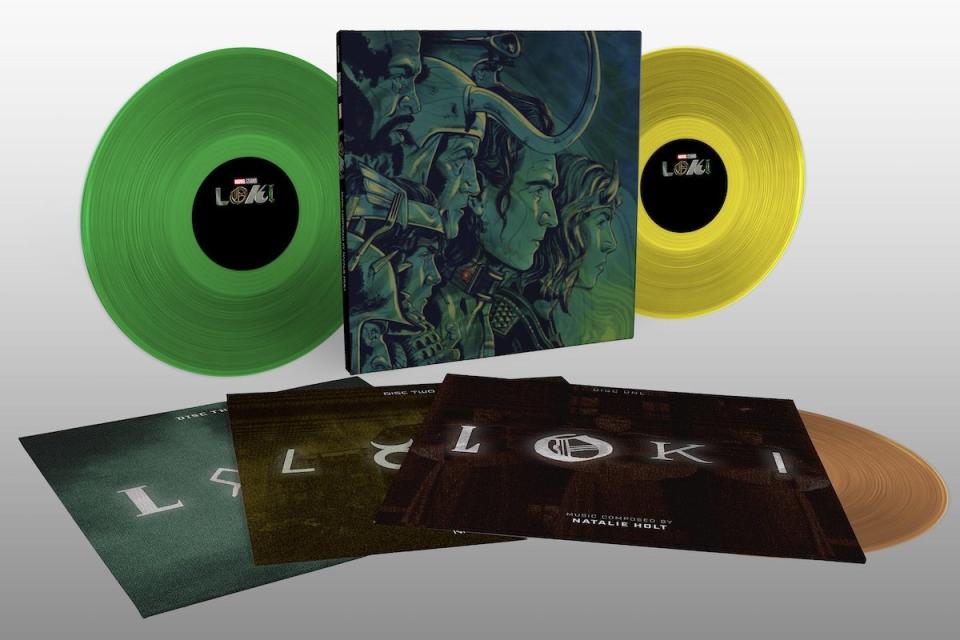 The set for Mondo's Loki season one score on full display with colored discs, original cover art, and slipcases with the show's title in different fonts laid out ont he ground