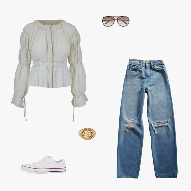 Try a boyfriend jean and romantic blouse for a classic cool-girl combination, as seen on Sophie Koella.