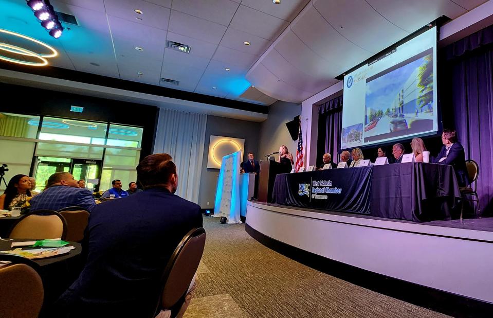 Shari Simmans, DeBary's director of economic development, communications and government affairs, speaks about an upcoming development project during the West Volusia Regional Chamber of Commerce's economic forum on Wednesday, April 5.