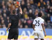 Referee Michael Oliver shows Manchester United's Antonio Valencia a red card during their English Premier League soccer match against Hull City at the KC Stadium in Hull, northern England December 26, 2013. REUTERS/Nigel Roddis