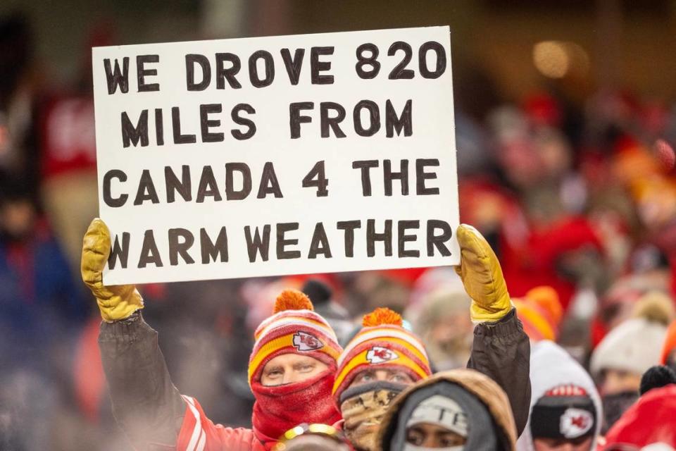 A Kansas City Chiefs fan holds a sign during an AFC Wild Card game against the Miami Dolphins at GEHA Field at Arrowhead Stadium on Saturday, Jan. 13, 2024, in Kansas City. The game marked the fourth-coldest in NFL history.