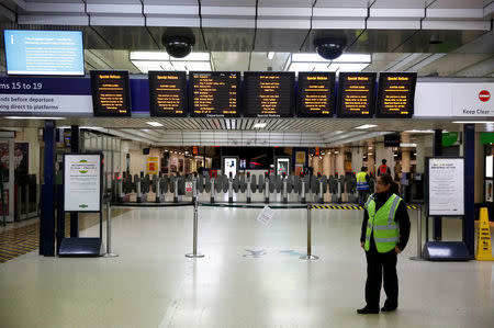 FILE PHOTO: Boards advising passengers of industrial action by Southern railway workers are displayed at Victoria station in London, Britain December 13, 2016. REUTERS/Neil Hall/File Photo