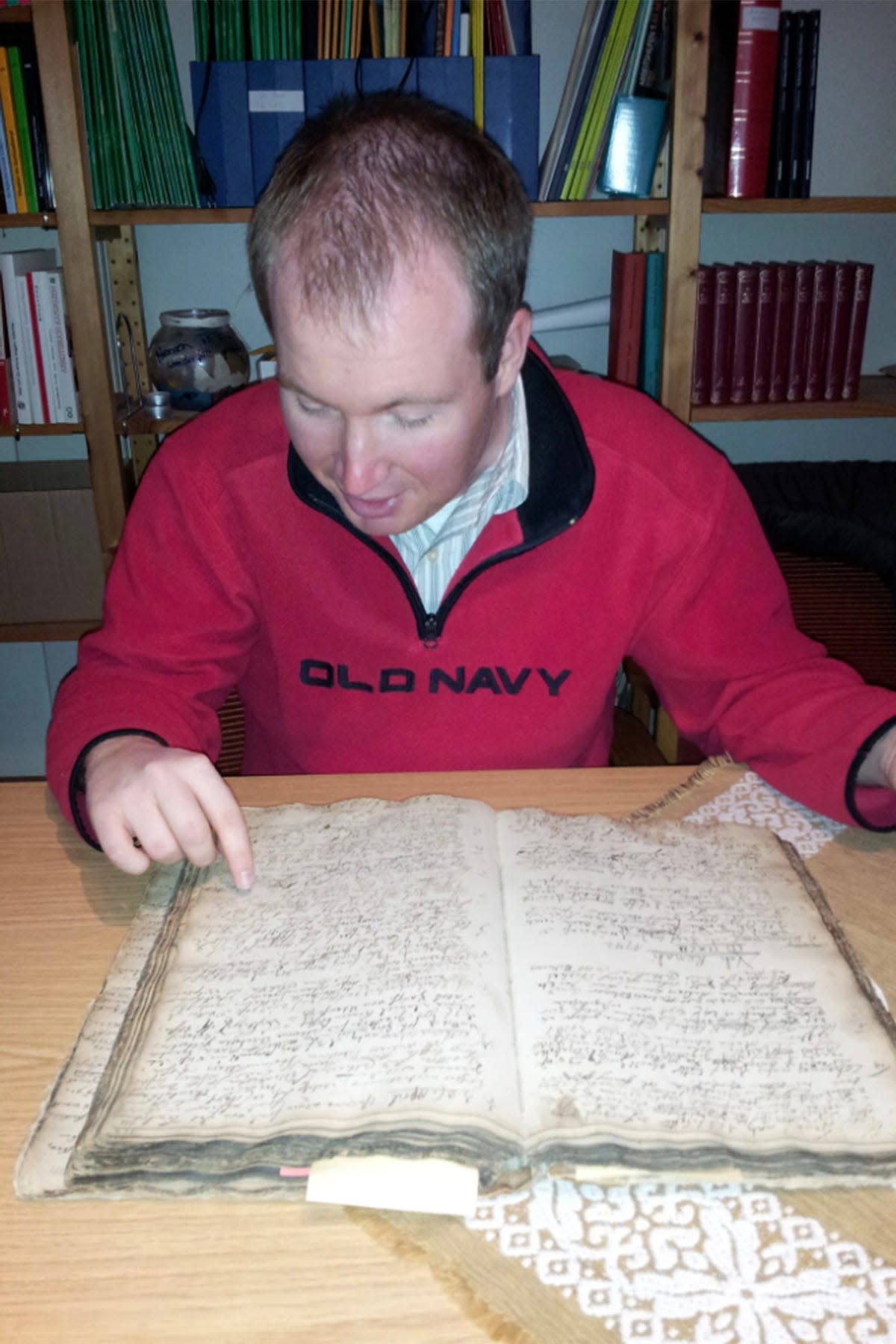 Michael McCormick, Middle Tennessee State University Ph.D. public history candidate, shown here reviewing a historical document, said he has always had a passion for genealogy and recently completed his program-required internship placement with nonprofit Reclaim the Records, helping to release over 100 years of Maryland vital records.