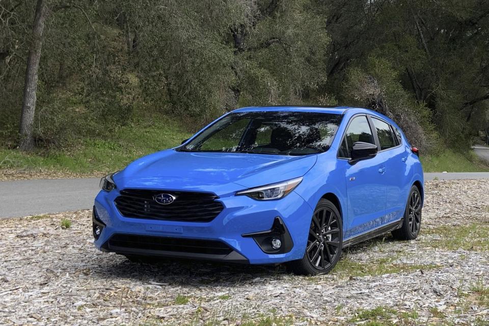 This photo provided by Edmunds shows the 2024 Impreza hatchback. The Impreza's RS trim has sporty styling details and a more powerful engine. (Brent Romans/Edmunds via AP)