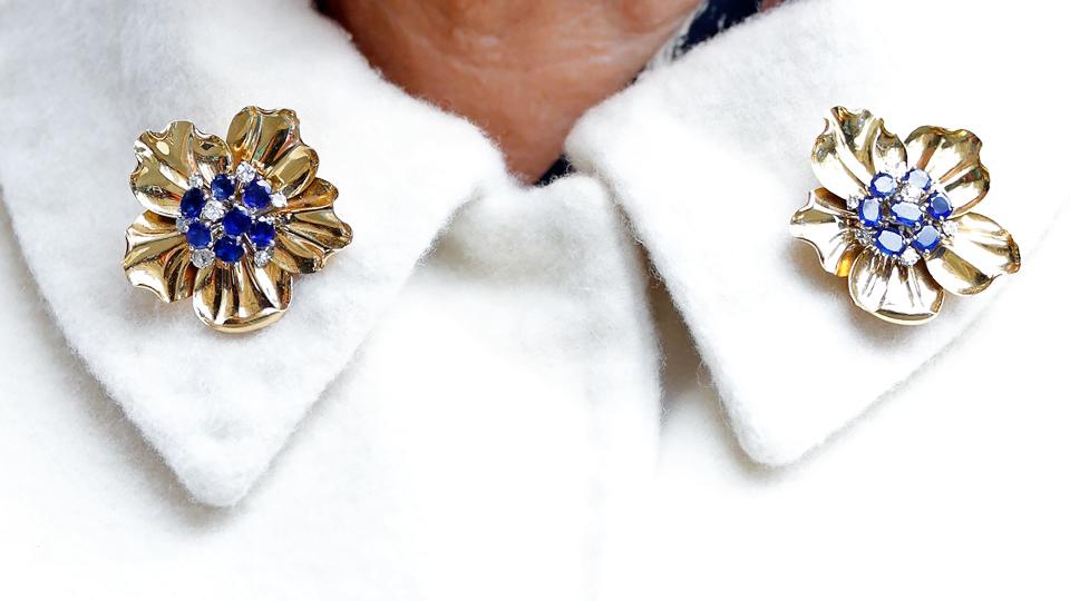 A close up of the late Queen's Cartier brooches