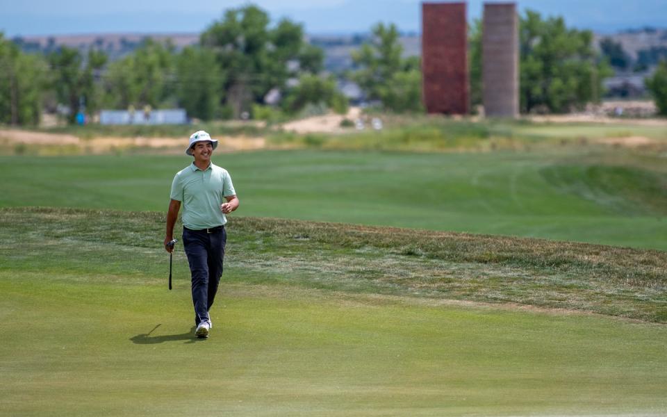 Professional golfer Zecheng "Marty" Dou smiles as he walks to the 18th green in the final round of The Ascendant at TPC Colorado in Berthoud, Colo. on Sunday, July 3, 2022.