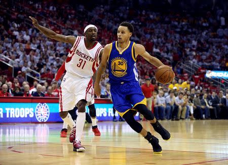 May 23, 2015; Houston, TX, USA; Golden State Warriors guard Stephen Curry (30) dribbles past Houston Rockets guard Jason Terry (31) during the game in game three of the Western Conference Finals of the NBA Playoffs at Toyota Center. Troy Taormina-USA TODAY Sports