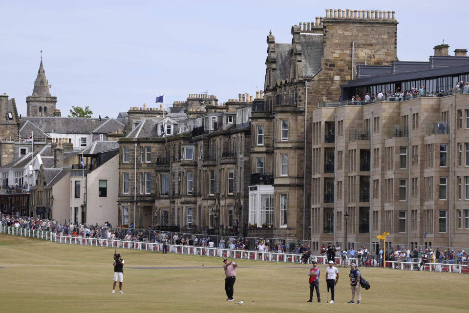 Former British Open champion Mark Calcavecchica of the United States plays a shot on the first hole during a 'Champions round' as preparations continue for the British Open golf championship on the Old Course at St. Andrews, Scotland, Monday July 11, 2022. The Open Championship returns to the home of golf on July 14-17, 2022, to celebrate the 150th edition of the sport's oldest championship, which dates to 1860 and was first played at St. Andrews in 1873. (AP Photo/Peter Morrison)