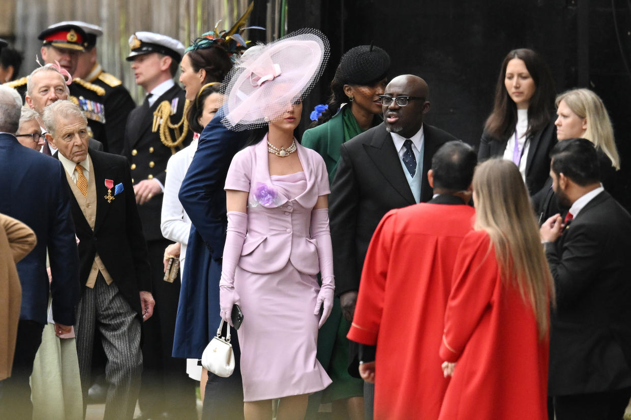 LONDON, ENGLAND - MAY 06: Katy Perry and Edward Enninful arrive at Westminster Abbey ahead of the Coronation of King Charles III and Queen Camilla on May 06, 2023 in London, England. The Coronation of Charles III and his wife, Camilla, as King and Queen of the United Kingdom of Great Britain and Northern Ireland, and the other Commonwealth realms takes place at Westminster Abbey today. Charles acceded to the throne on 8 September 2022, upon the death of his mother, Elizabeth II. (Photo by Dan Kitwood/Getty Images)