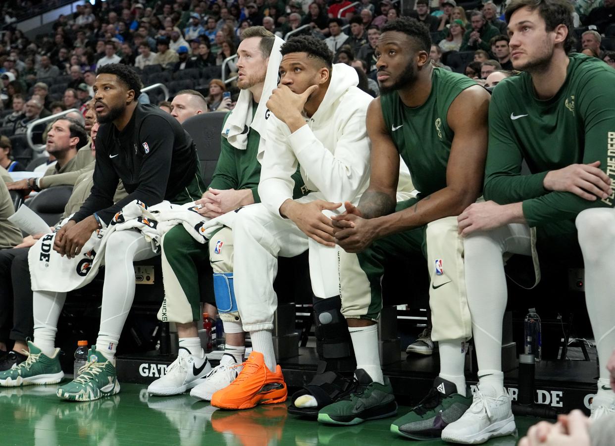 Injured Milwaukee Bucks forward Giannis Antetokounmpo, white hoodie, is shown during the first half of their game against the Orlando Magic Wednesday, April 10, 2024 at Fiserv Forum in Milwaukee, Wisconsin.