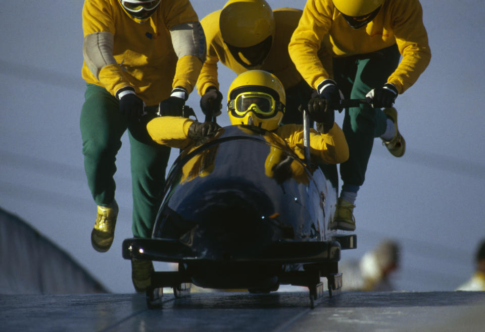 <p>The four-man competition was never something the Jamaicans had planned to do. However after their success in the two-man competition, the team decided to give it a shot. Fitch quickly raised money by selling popular “Jamaican Bobsled t-shirts” and purchased a four-man sled. (Getty Images) </p>