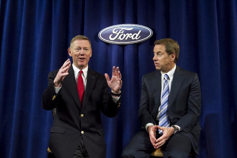 Ford Motor Company President and CEO Alan Mulally, left, answers questions from the media while Executive Chairman for Ford William Ford looks on minutes after the company's annual shareholders meeting at the Hotel DuPont in Wilmington, Del., Thursday, May 10, 2012. Thursday's meeting lasted only 45 minutes, much of it spent with shareholders praising CEO Alan Mulally and Executive Chairman Bill Ford Jr. for the company's turnaround. (AP Photo/Ron Soliman)
