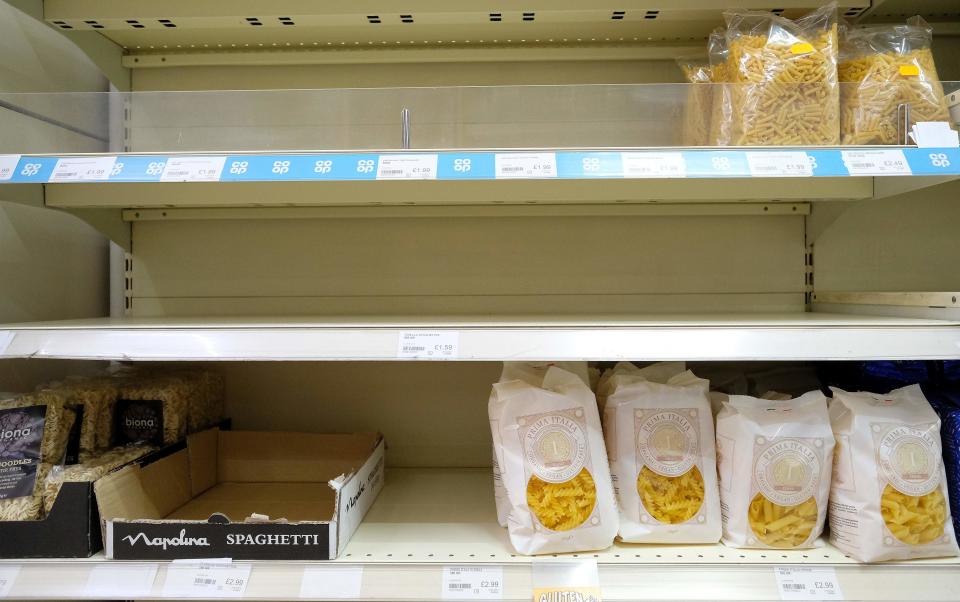 Almost-empty shelves where pasta would normally be stocked are pictured inside a supermarket store in north London on March 31, 2020, as life in Britain continues during the nationwide lockdown to combat the novel coronavirus pandemic. - The novel coronavirus pandemic has so far claimed nearly 38,000 lives worldwide in a health crisis that is rapidly reorganising political power, hammering the global economy and the daily existence of some 3.6 billion people. (Photo by Isabel INFANTES / AFP) (Photo by ISABEL INFANTES/AFP via Getty Images)