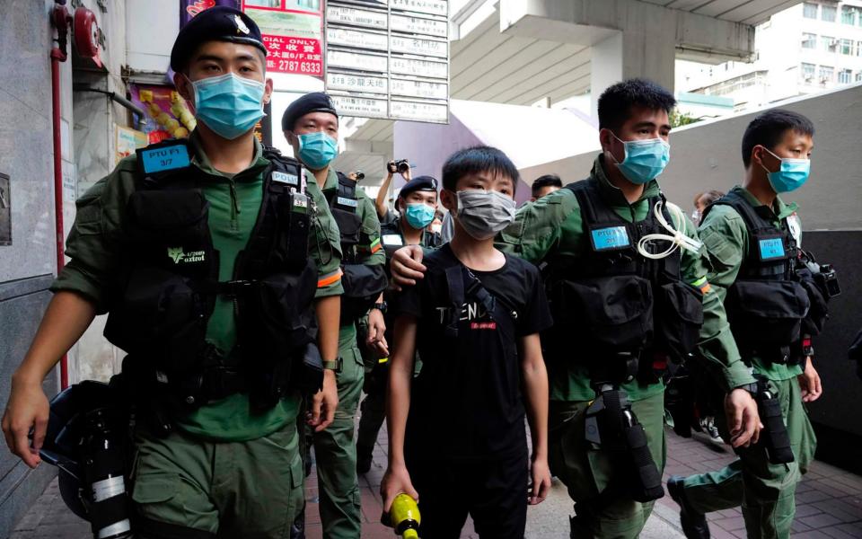 Police were out in force on Monday night as protesters took to the streets again - Vincent Yu/AP