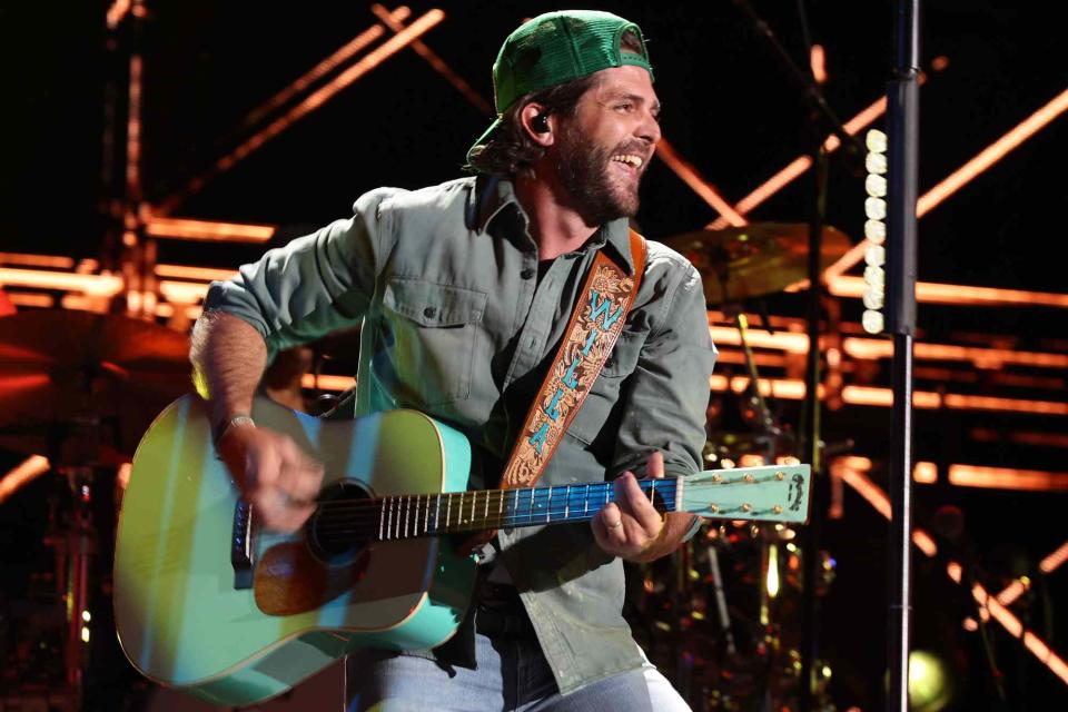 <p>Terry Wyatt/WireImage</p> Thomas Rhett performs at the 2024 CMA Music festival at Nissan Stadium  on June 6, 2024 in Nashville