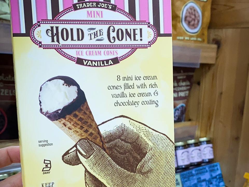 hand holding box of hold the cone mini ice cream cones at trader joes