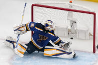 St. Louis Blues goaltender Ville Husso watches as a puck shot by Colorado Avalanche's Nazem Kadri slips past for a goal during the second period in Game 4 of an NHL hockey Stanley Cup second-round playoff series Monday, May 23, 2022, in St. Louis. (AP Photo/Jeff Roberson)