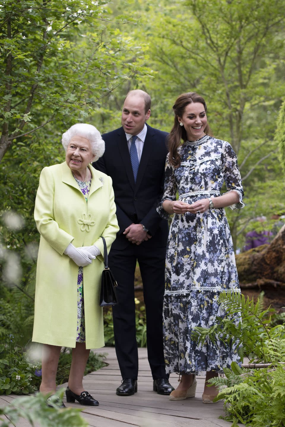 <p>Queen Elizabeth is given a tour around Kate Middleton's <a href="https://www.harpersbazaar.com/celebrity/latest/a27457588/kate-middleton-designs-garden-chelsea-flower-show-new-photos/" rel="nofollow noopener" target="_blank" data-ylk="slk:'Back to Nature Garden';elm:context_link;itc:0;sec:content-canvas" class="link ">'Back to Nature Garden'</a> at the RHS Chelsea Flower Show.</p>