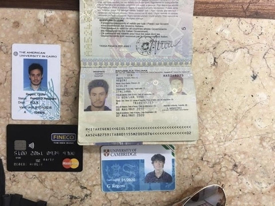 FILE -- In this file photo released by the Egyptian Ministry of Interior on Thursday, Mar. 24, 2016, personal belongings of slain Italian graduate student Giulio Regeni, including his passport, are displayed. Four high-level Egyptian security officials are going on trial Tuesday, Feb. 20, 2024, in absentia in a Rome court, accused in the 2016 abduction, torture and slaying of an Italian doctoral student in Cairo.(Egyptian Interior Ministry via AP, File)