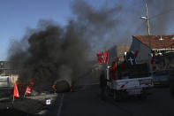 Protesters prepare to leave the Mediterranean port city of Marseille, southern France, after tensions, Thursday, Dec.12, 2019. Unions have flatly rejected fresh proposals by the government of pro-business President Emmanuel Macron to stagger the roll-out of a plan that would require France's youngest workers - people born after 1974 - to stay on the job until the age of 64 to get full pensions instead of age 62. (AP Photo/Daniel Cole)