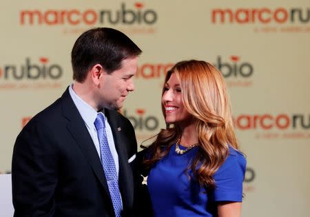 U.S. Senator Marco Rubio (R-FL) embraces his wife Jeanette as she comes out to join him after he announced his bid for the Republican nomination in the 2016 U.S. presidential election race during a speech at the Freedom Tower in Miami, Florida April 13, 2015. REUTERS/Joe Skipper