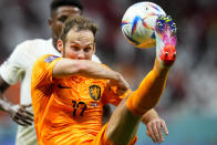 Daley Blind of the Netherlands connects a shot during a World Cup group A soccer match against Qatar at the Al Bayt Stadium in Al Khor, Qatar, Tuesday, Nov. 29, 2022. (AP Photo/Petr David Josek)