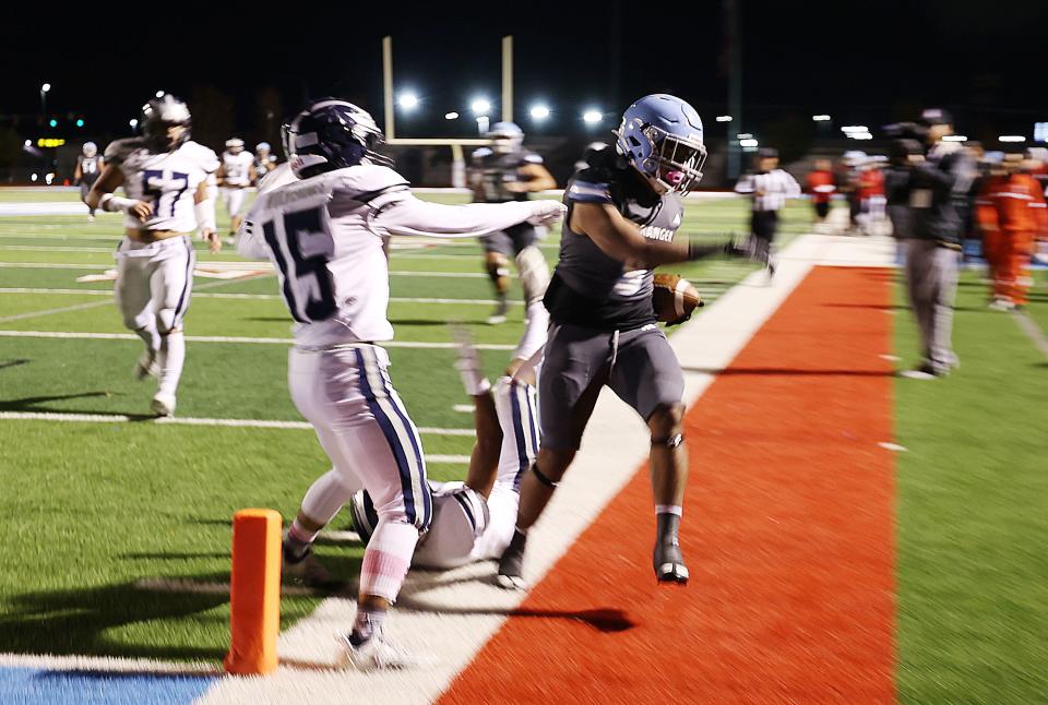 Granger’s Jordan Tu’uao is forced out of bounds just before scoring a touchdown by Hunter’s Antheny Riggs and Saiosi Kolomatangi as they play at Granger in West Valley City on Wednesday, Oct. 11, 2023. | Scott G Winterton, Deseret News