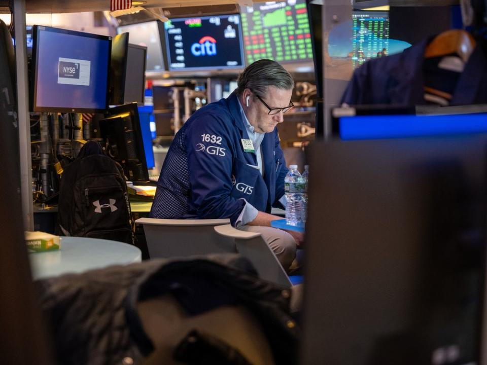  A trader on the floor of the New York Stock Exchange.