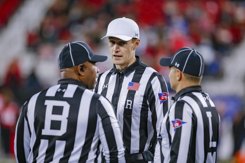 Conference USA officials referee Justin Elliott talks with back judge Chris Bynum and linesman Jerry Harris during the Western Kentucky Hilltoppers against the Fiu Golden Panthers game on October 27, 2018 in Bowling Green, Kentucky. (Getty)