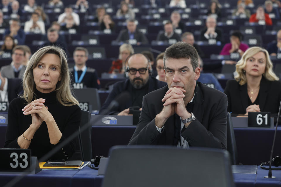 European Parliament members listen to assembly President Roberta Metsola during a special session on lobbying Monday, Dec. 12, 2022 at the European Parliament in Strasbourg, eastern France. Four people have been charged with being part of a criminal group, money laundering and corruption in connection with an investigation into suspected influence peddling by a Persian Gulf country at the European Union's parliament. (AP Photo/Jean-Francois Badias)