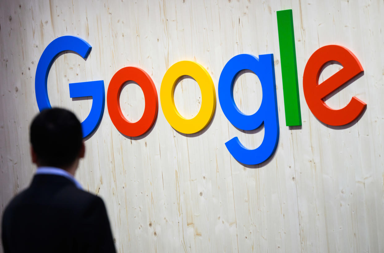 25 April 2024, Lower Saxony, Hanover: Trade fair visitors walk past a Google logo at the Google stand at Hannover Messe 2024. Photo: Julian Stratenschulte/dpa (Photo by Julian Stratenschulte/picture alliance via Getty Images)