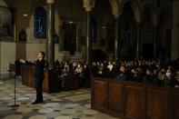 People attend a live concert, part of 62 cultural events of sacred music festival organized by the National Opera, at the Catholic Cathedral of Saint Dionysius in Athens, Greece, on Monday, April 18, 2022. For the first time in three years, Greeks were able to celebrate Orthodox Easter without the restrictions made necessary by the coronavirus pandemic. (AP Photo/Thanassis Stavrakis)