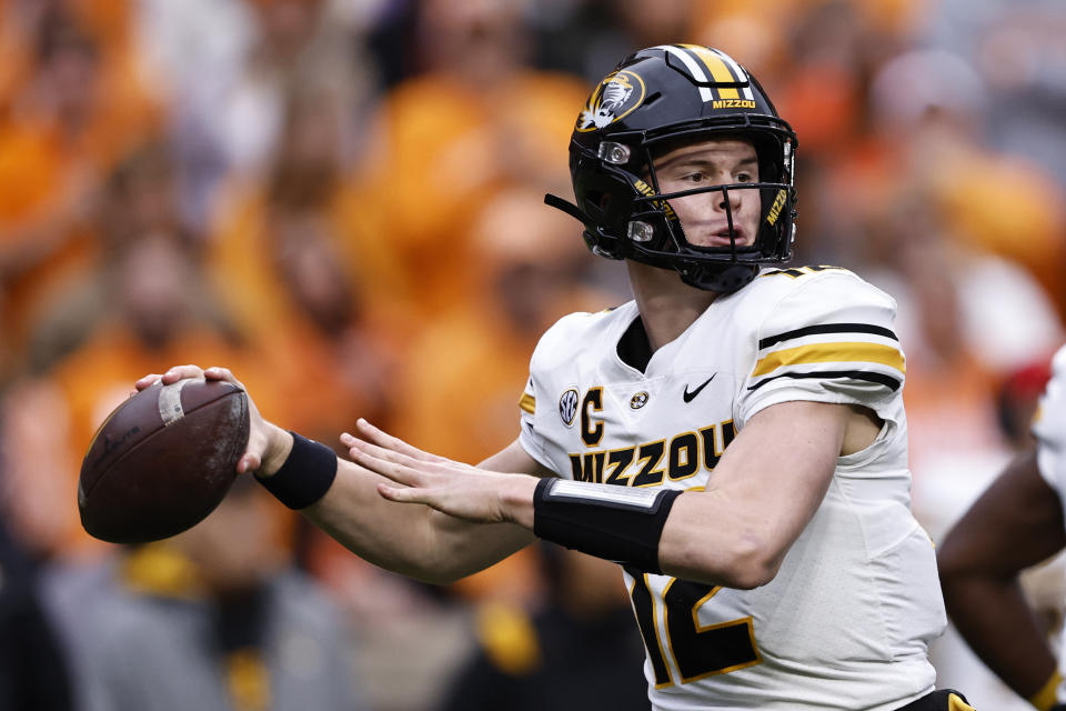 FILE - Missouri quarterback Brady Cook (12) throws to a receiver during the first half of an NCAA college football game against Tennessee Saturday, Nov. 12, 2022, in Knoxville, Tenn. Missouri opens their season at home against South Dakota on Aug. 31. (AP Photo/Wade Payne, File)