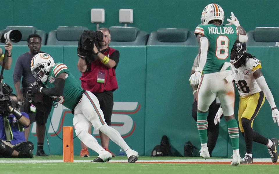 Miami Dolphins cornerback Noah Igbinoghene (9) intercepts a pass late in the game against the Pittsburgh Steelers at Hard Rock Stadium in Miami Gardens, Oct. 23, 2022. 