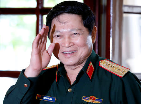 Vietnam's Defence Minister General Ngo Xuan Lich greets the media as he arrives for a meeting with U.S. Secretary of Defense Jim Mattis (not pictured) in Ho Chi Minh City, Vietnam, October 17, 2018. REUTERS/Kham/Pool