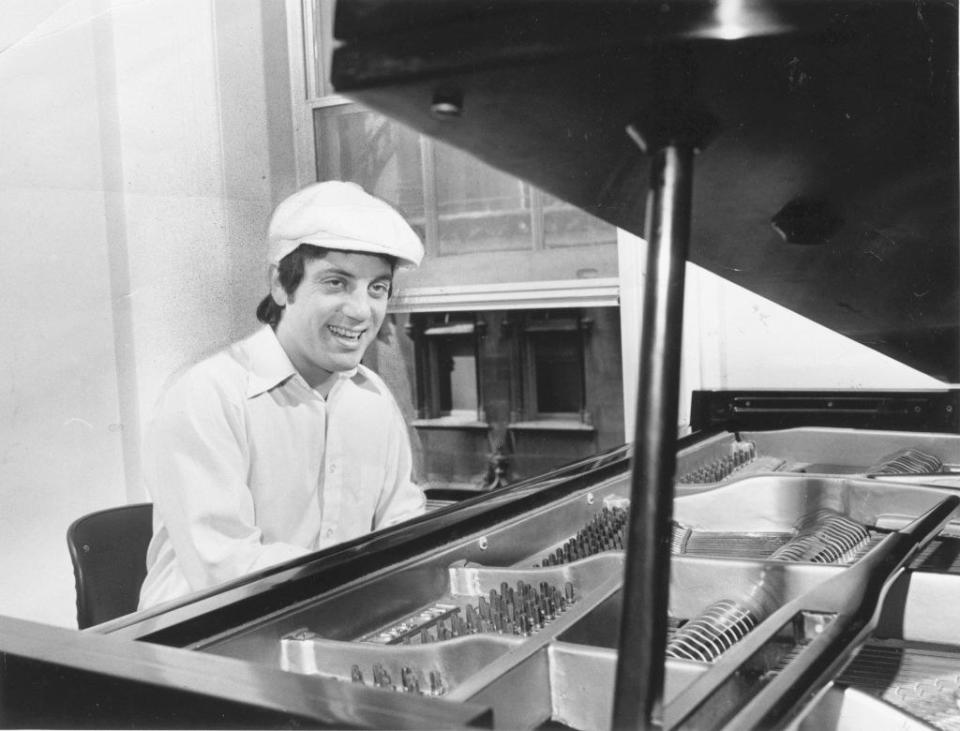 A young Joel at the piano