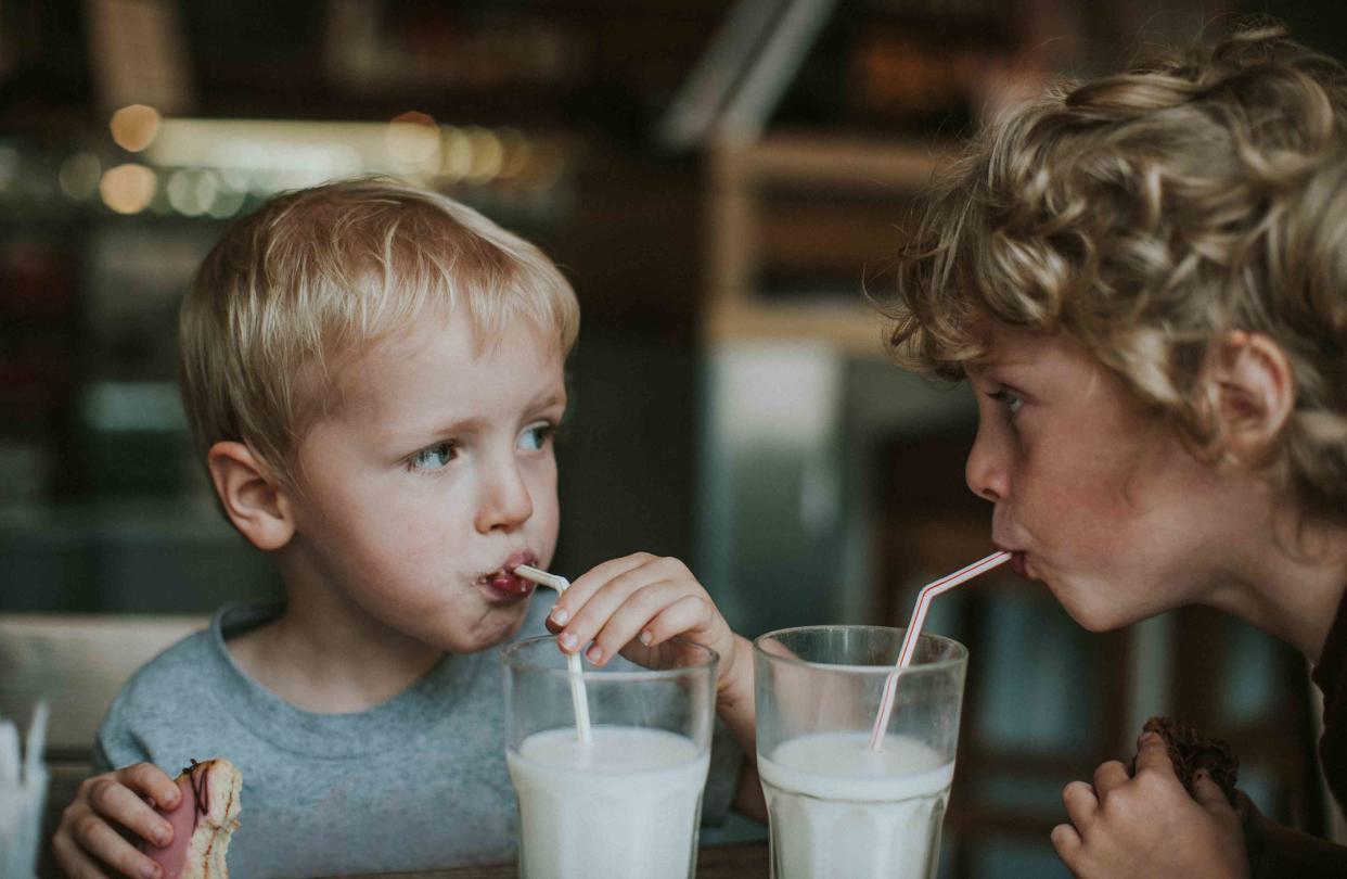 <p>Catherine Falls Commercial / Getty Images</p> Children at a cafe