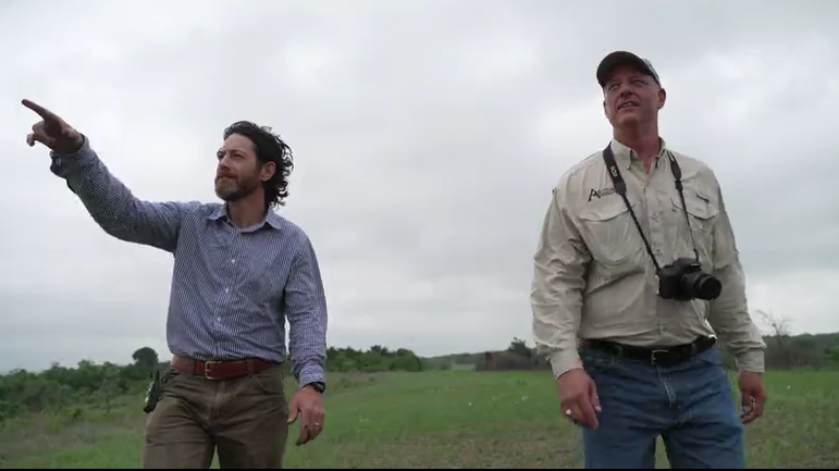 Matt McCaw and John Davis with the Austin Parks and Recreation Department walk through the Louis René Barrera Indiangrass Wildlife Sanctuary in East Austin. 