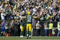 Green Bay Packers' Aaron Rodgers reacts after throwing a touchdown pass to Jake Kumerow during the first half of an NFL football game against the Oakland Raiders Sunday, Oct. 20, 2019, in Green Bay, Wis. (AP Photo/Jeffrey Phelps)
