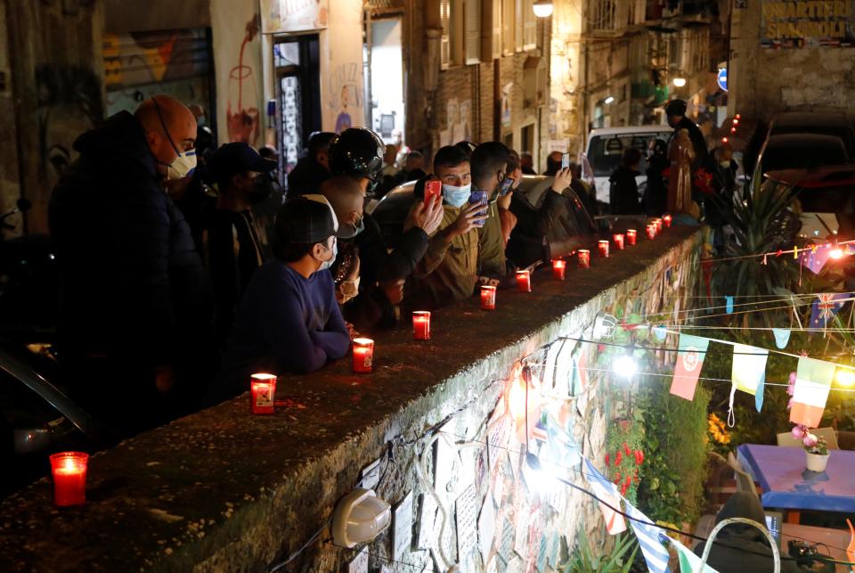 People line the streets of the city of Naples to pay tribute to MaradonaReuters