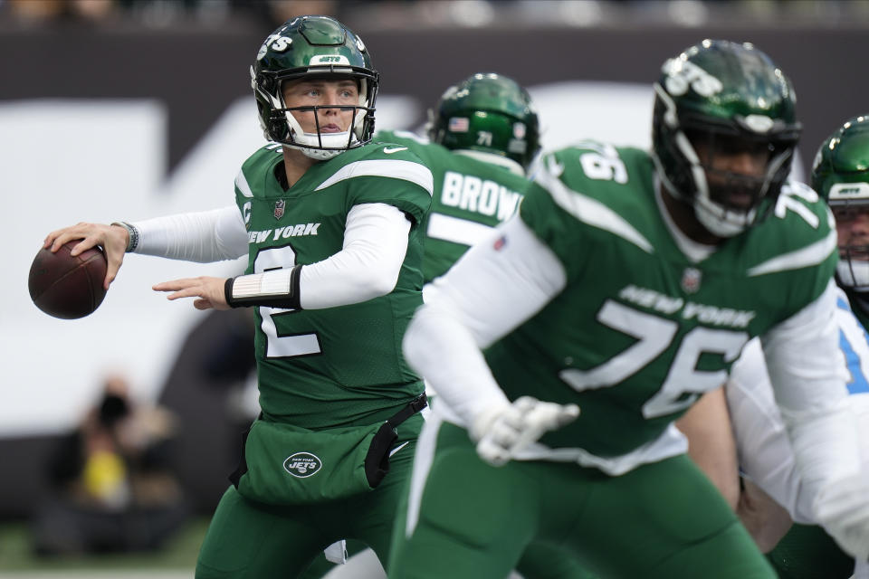 New York Jets quarterback Zach Wilson (2) steps back to pass against the Detroit Lions during the first quarter of an NFL football game, Sunday, Dec. 18, 2022, in East Rutherford, N.J. (AP Photo/Seth Wenig)
