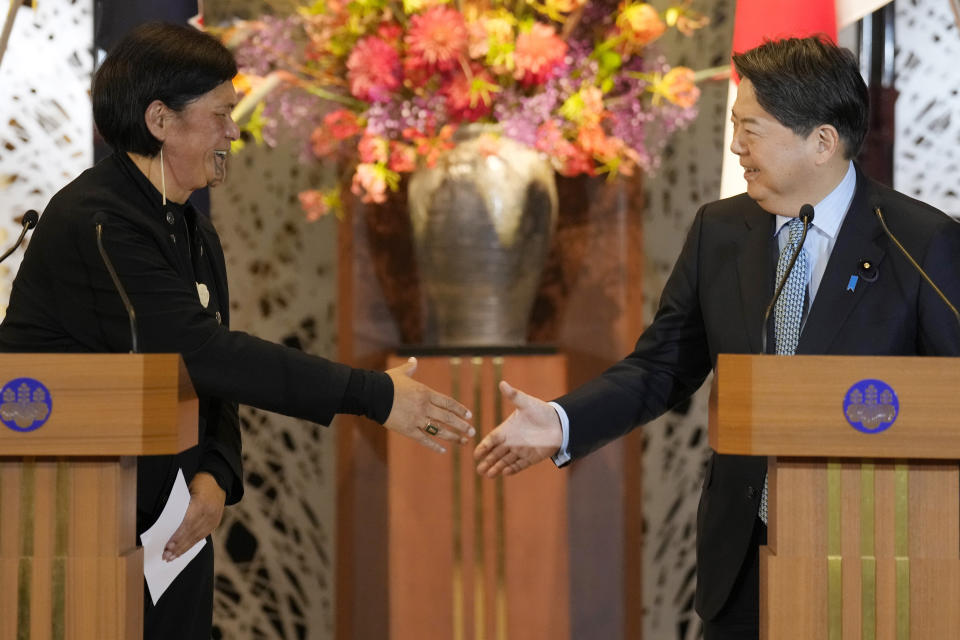 New Zealand Foreign Minister Nanaia Mahuta, left, and Japanese Foreign Minister Yoshimasa Hayashi, right, shake hands after a joint press conference after their meeting at Iikura Guest House Monday, Feb. 27, 2023, in Tokyo. (AP Photo/Eugene Hoshiko)