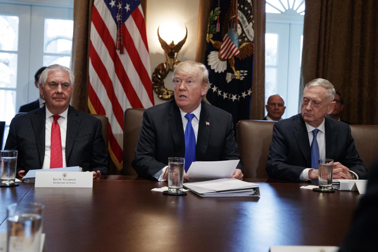 Secretary of State Rex Tillerson, left, and Secretary of Defense Jim Mattis, right, listen as President Donald Trump speaks during a cabinet meeting at the White House: AP Photo/Evan Vucci