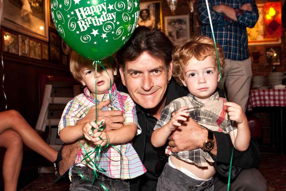 <p>Chelsea Lauren/WireImage</p> Charlie Sheen with young Max and Bob in 2011